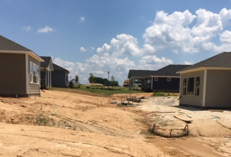 Erosion control devices between homes under construction